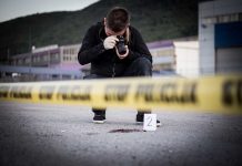 Photographer At Crime Scene