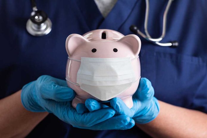 Nurse Holding A Piggy Bank