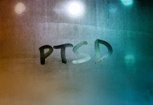 PTSD written on a window