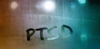 PTSD written on a window