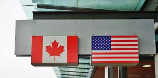 Canadian flag and US flag