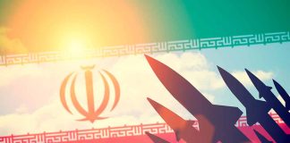 Iranian flag with silhouetted missiles and sunlight