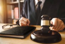 A judge with a hammer and a book
