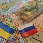 Ukrainian and Russian flags on a map