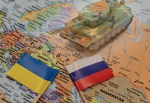 Ukrainian and Russian flags on a map