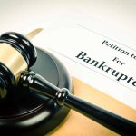 Gavel on bankruptcy petition document