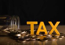 Tax letters with spilled jar of coins