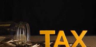 Tax letters with spilled jar of coins