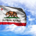 California Republic flag waving against blue sky