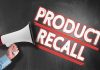 Person holding megaphone Product Recall text