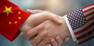 Chinese and American flag sleeves shaking hands