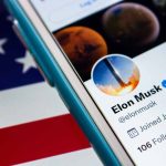 Smartphone showing a Twitter profile American flag background