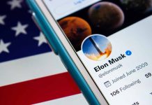 Smartphone showing a Twitter profile American flag background