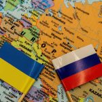 The Russian and Ukrainian flags on a map