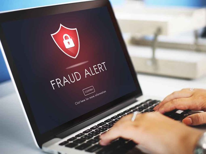412668235 featured image Laptop displaying fraud alert warning on screen