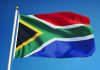 South African flag waving against blue sky