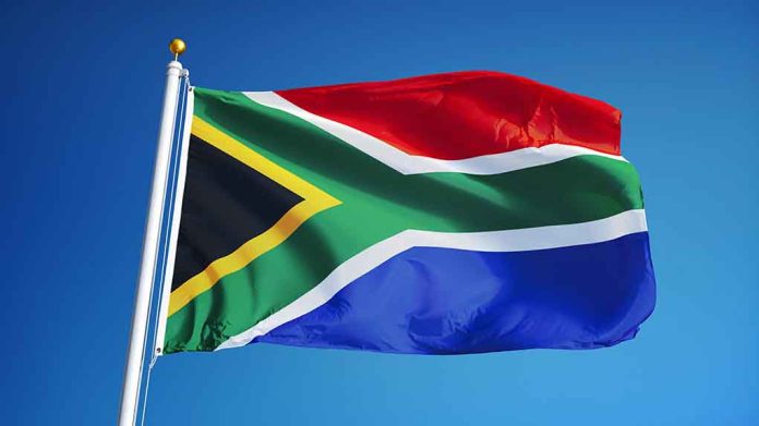 478550506 featured image South African flag waving against blue sky