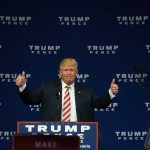Man giving thumbs up at a Trump Pence rally