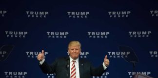 Man giving thumbs up at a Trump Pence rally