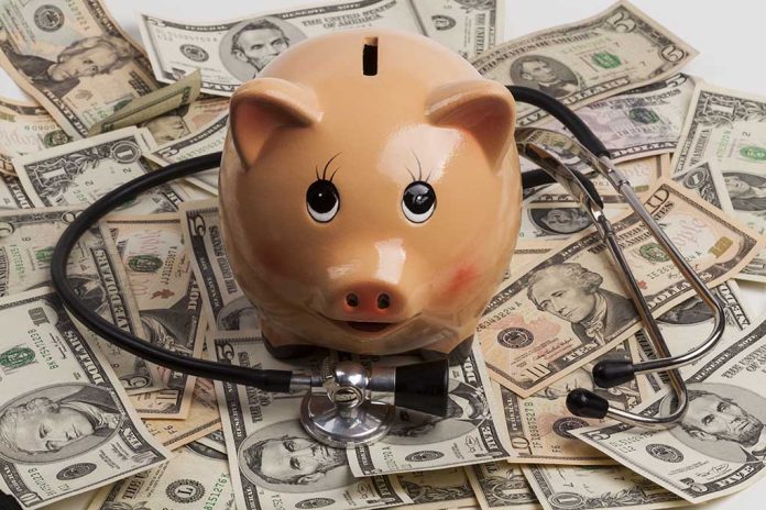749913631 featured image Piggy bank stethoscope money scattered underneath currency bills