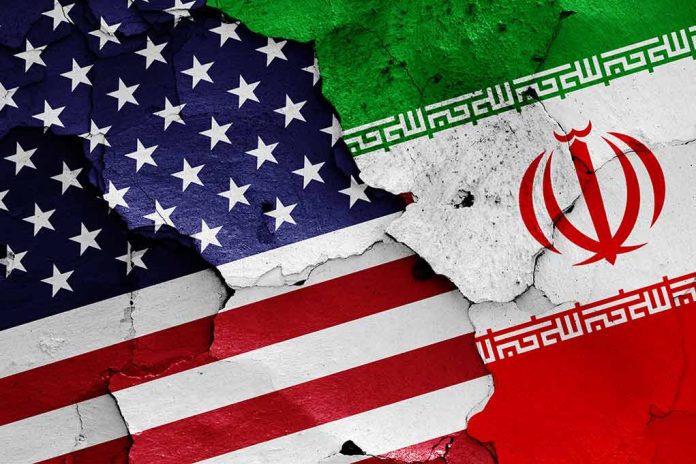 1152300314 featured image Cracked American and Iranian flags on a wall