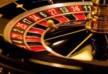 Closeup of roulette wheel with spinning ball