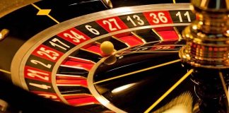 Closeup of roulette wheel with spinning ball