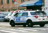 Police car and ambulances outside emergency room entrance