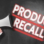 Person holding megaphone Product Recall text