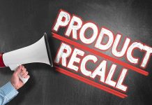 Person holding megaphone Product Recall text