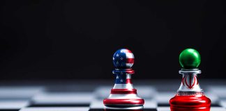 Chess pieces with USA and Iran flags on board