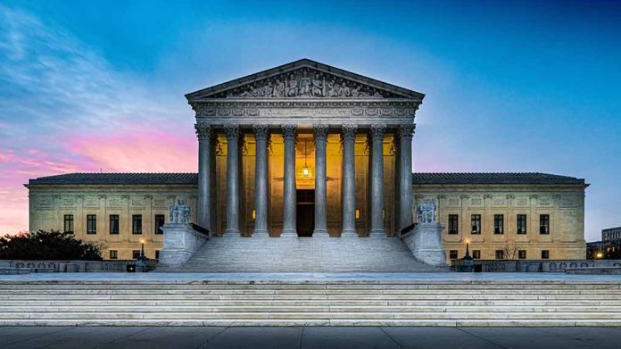 Supreme Court building with illuminated pillars and steps