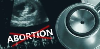 Ultrasound stethoscope and ABORTION crossed out in red