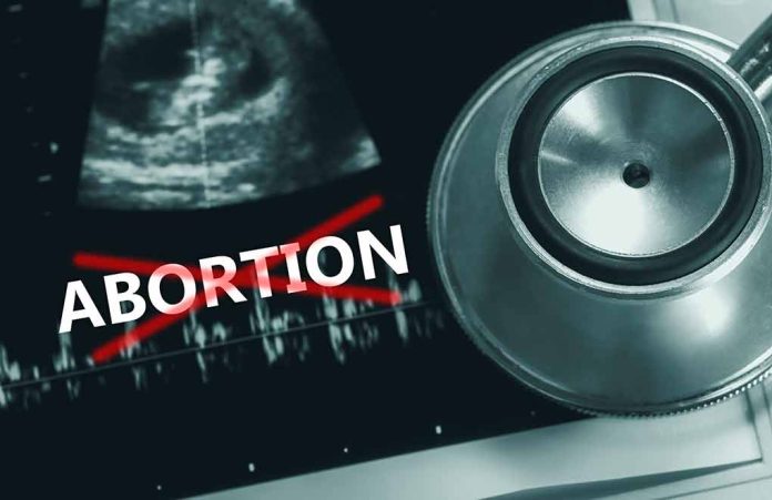2171348999 featured image Ultrasound stethoscope and ABORTION crossed out in red