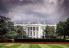 White House front view with dark clouds above