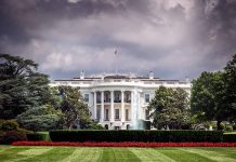 White House front view with dark clouds above