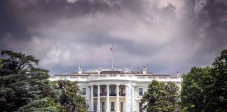 White House front view with dark clouds above