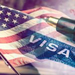 USA flag visa stamp and pen overlayed image
