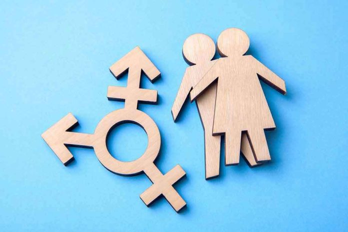 1145016626 Wooden transgender symbol and couple figures on blue background