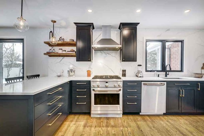 Modern kitchen with black cabinets and stainless appliances