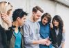 Group of friends looking at a smartphone