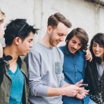Group of friends looking at a smartphone