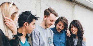 Group of friends looking at a smartphone