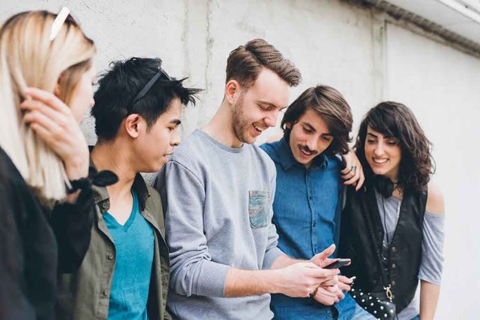 Group of friends looking at a smartphone