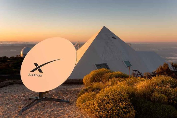 Satellite dish near pyramid shaped building at sunset