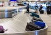 Luggage on airport baggage claim conveyor belt