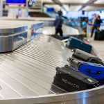 Luggage on airport baggage claim conveyor belt