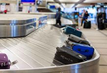 Luggage on airport baggage claim conveyor belt