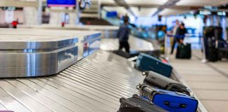 Luggage on airport baggage claim conveyor belt