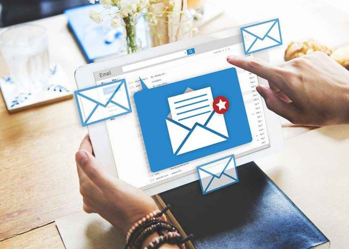 Tablet displaying email inbox with notifications icon